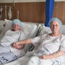 Husband and wife, Margaret and Gary, in a hospital bed at Austin Hospital before living donor kidney transplant surgery